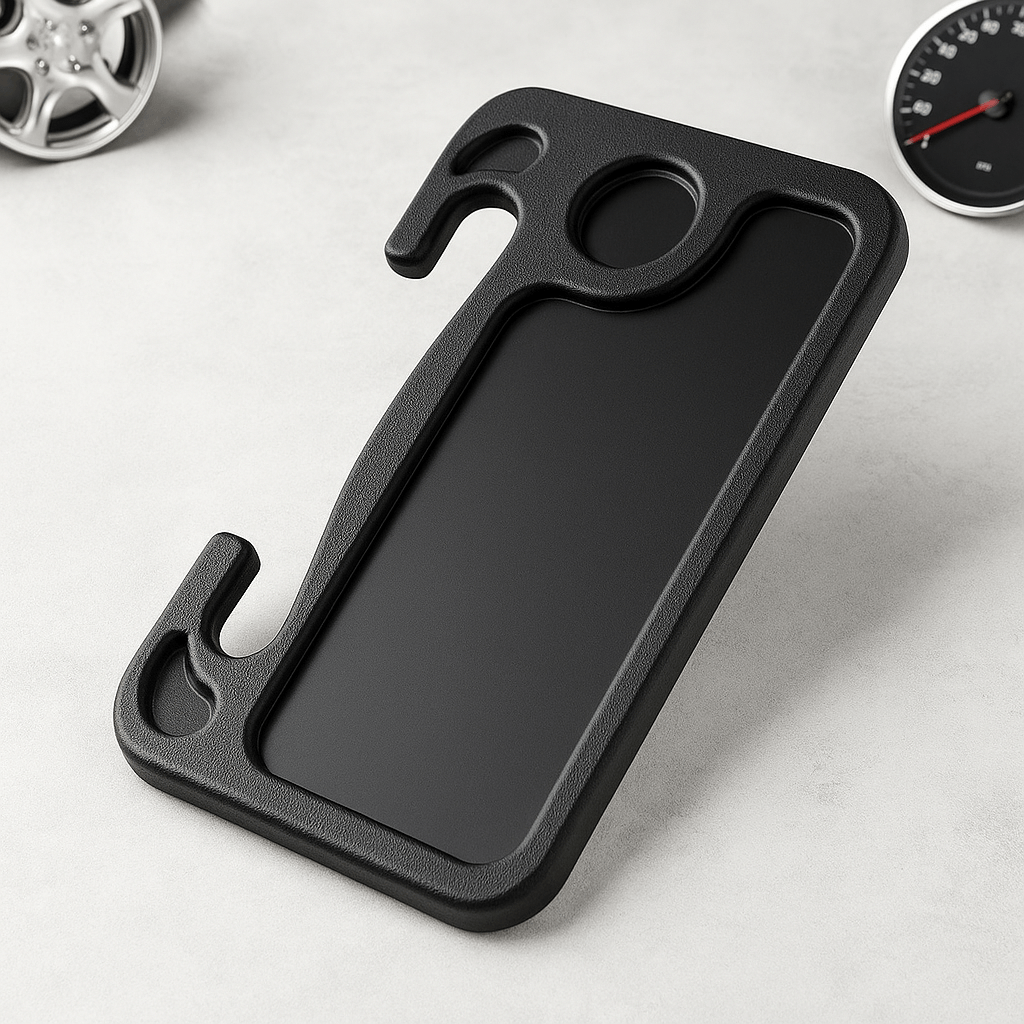Portable car steering wheel tray resting on a surface with design features for ergonomic use while driving.