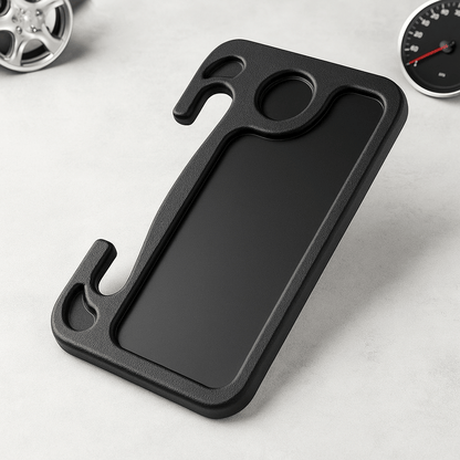 Portable car steering wheel tray resting on a surface with design features for ergonomic use while driving.