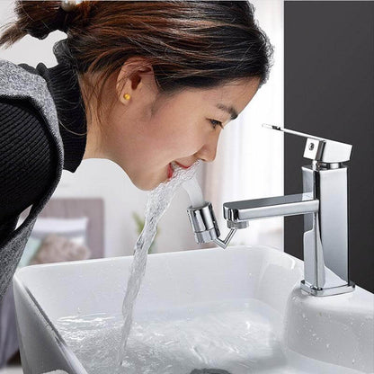 Person using a universal faucet splash guard to drink water from a sink efficiently.