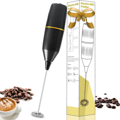 Handheld milk frother in black with coffee beans and latte art, perfect for frothing lattes and cappuccinos.