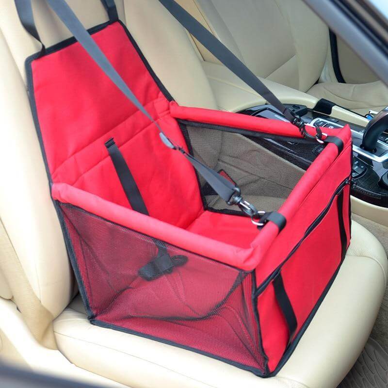 dog travel car seat carrier securely installed in a car seat with safety straps and padded interior for pet comfort.