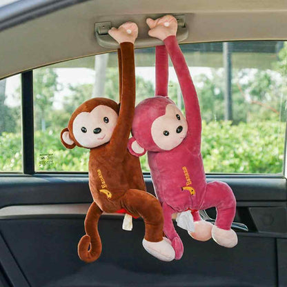 Two cute hanging monkey tissue holders in a car, providing a fun and functional tissue storage solution.