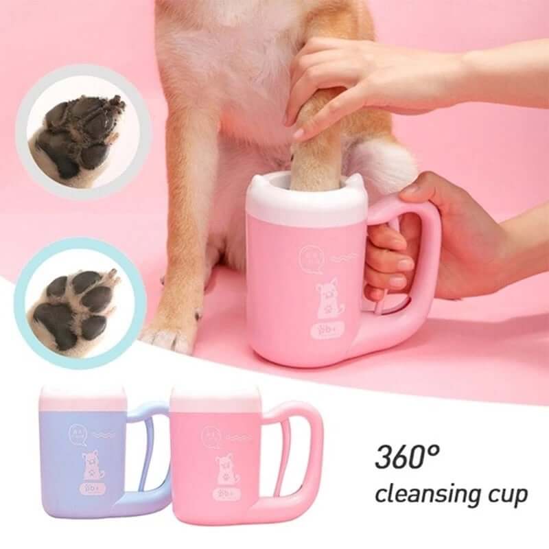 Portable dog paw cleaner in action, removing dirt from dog's paw with silicone bristles in a pink cleansing cup.