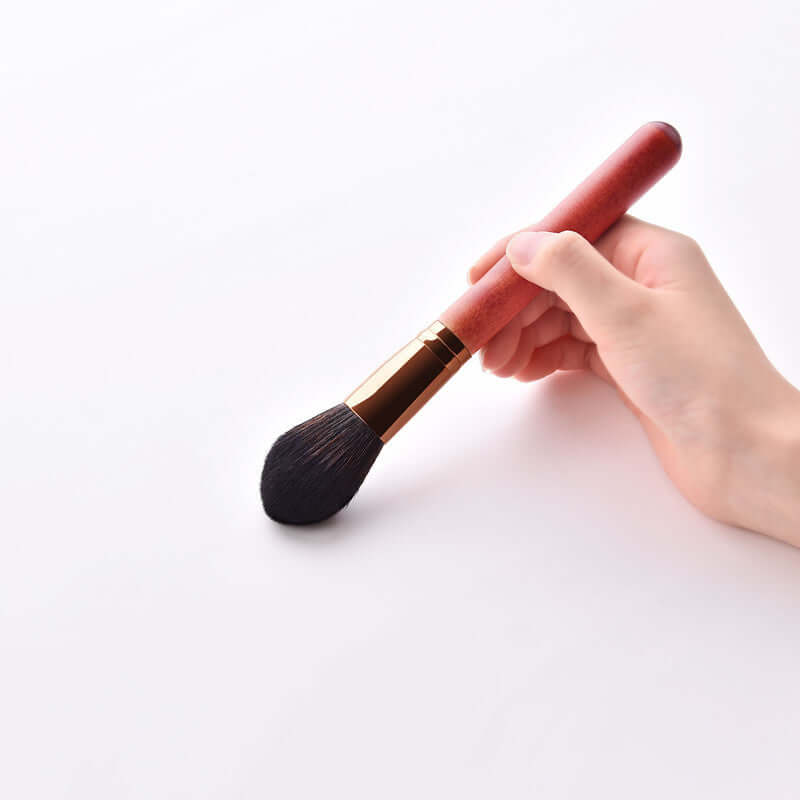 12-Piece Makeup Brush Set with Powder Brush and Wood Brushes in hand showing soft bristles and wooden handle