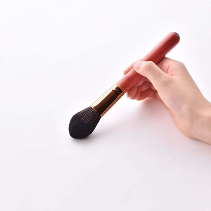 12-Piece Makeup Brush Set with Powder Brush and Wood Brushes in hand showing soft bristles and wooden handle