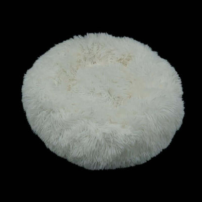 Calming donut bed for pets, ultra-soft, fluffy, and cozy round bed for dogs and cats.